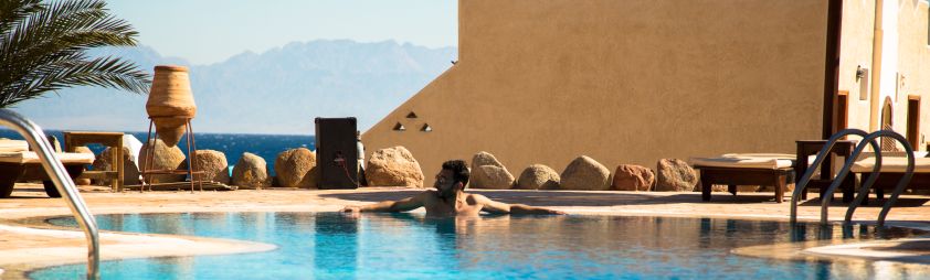 Hotel pool with mountain and sea views